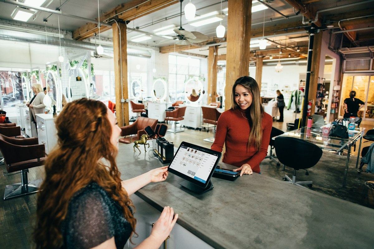 Small business owner reviewing figures on a tablet